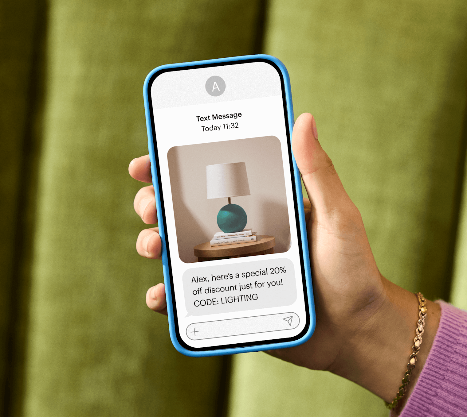 Image of a person looking at a smartphone displaying Mailchimp’s SMS feature using the fictitious brand Assembly. The visual displays how users can use Mailchimp to unify marketing under one roof by seamlessly integrating SMS into your email, automations, and social campaigns.